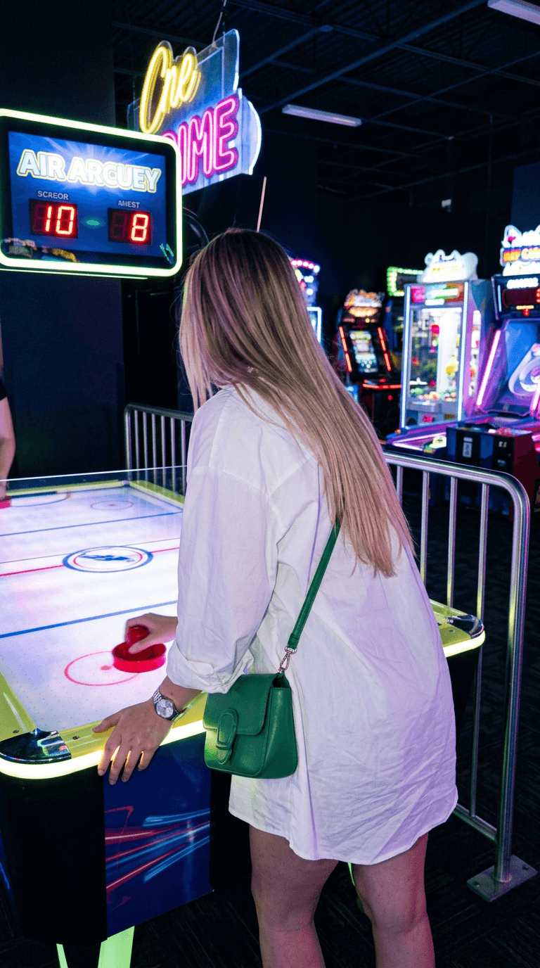 AI-generated night out photo playing air hockey at an arcade